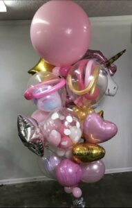 Pink, gold, and silver balloons