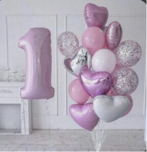 Pink balloons for a 1st birthday celebrant