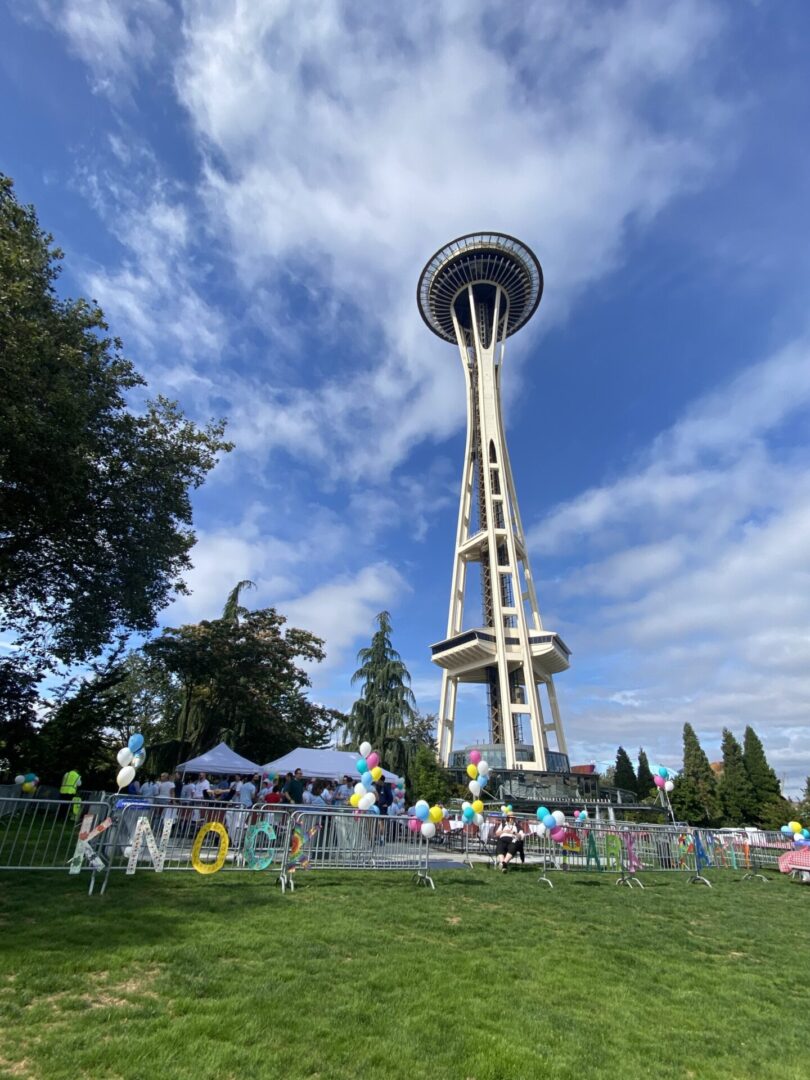 Outdoor Corporate employee appreciation party on Space Needle lawn. Custom Balloons for Event Venue Weddings and Parties.